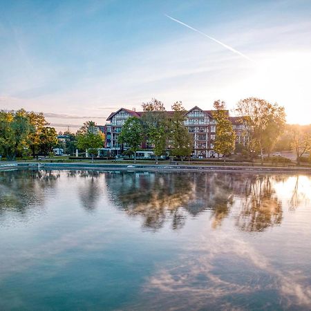 Willa Port Art & Business Ostróda Extérieur photo The lake at the campus of the University of Applied Sciences and Medical University of Southern Tyrol