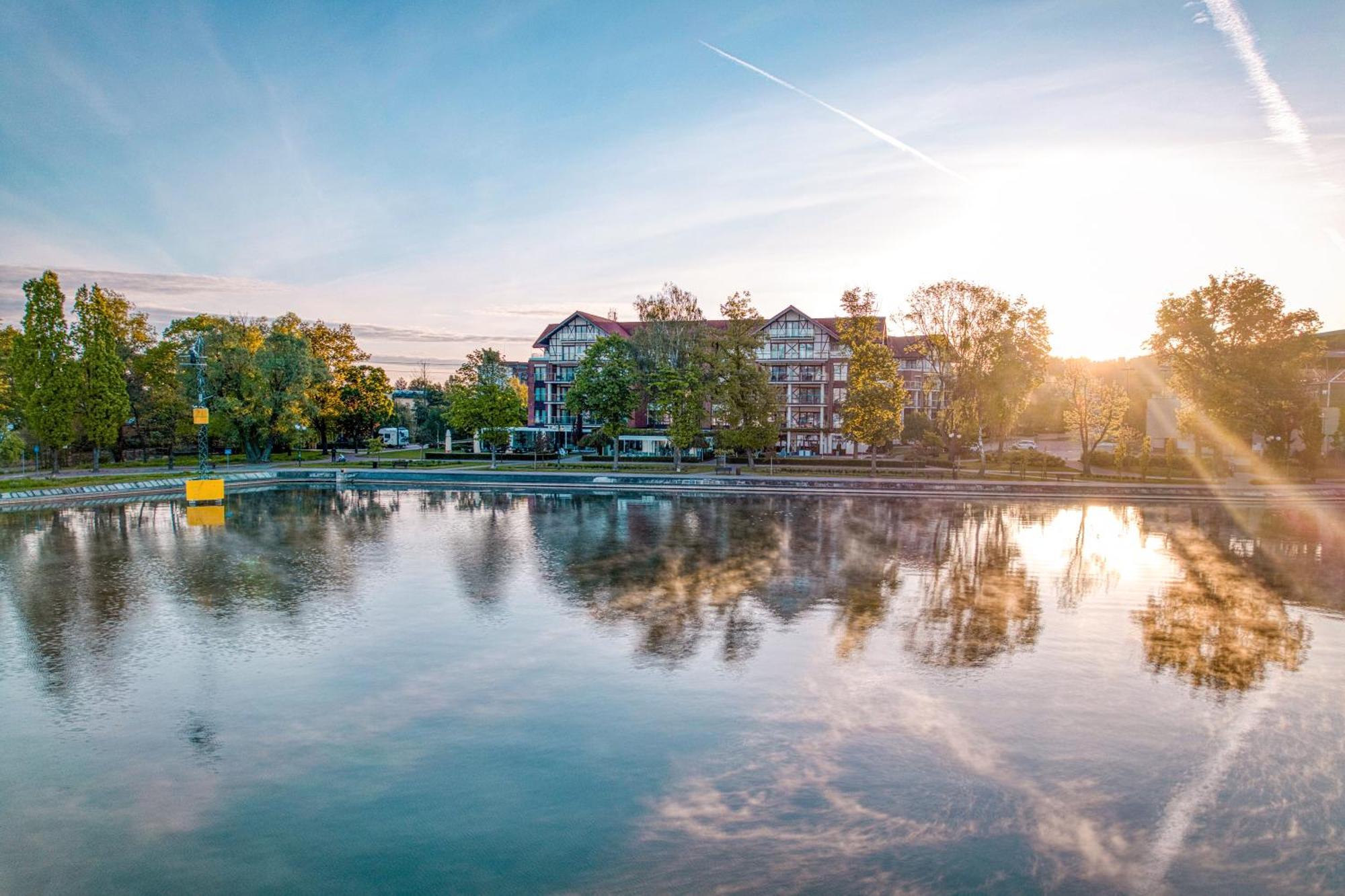 Willa Port Art & Business Ostróda Extérieur photo The lake at the campus of the University of Applied Sciences and Medical University of Southern Tyrol